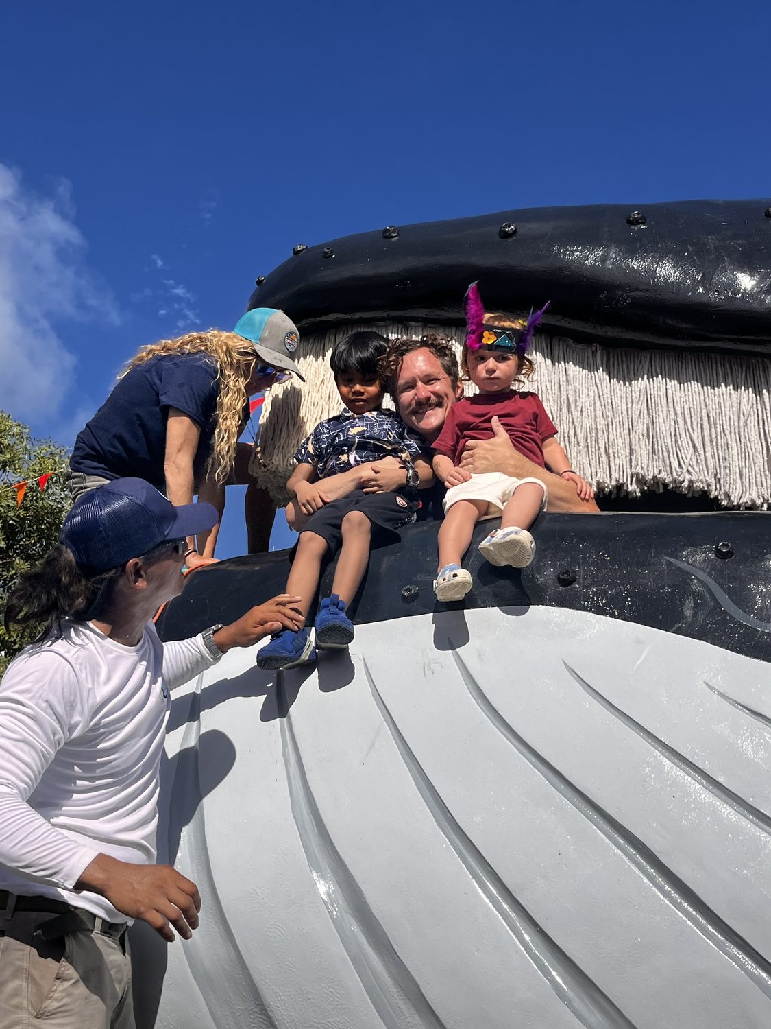 Students inside the Beyond The Reef humpback whale sculpture classroom